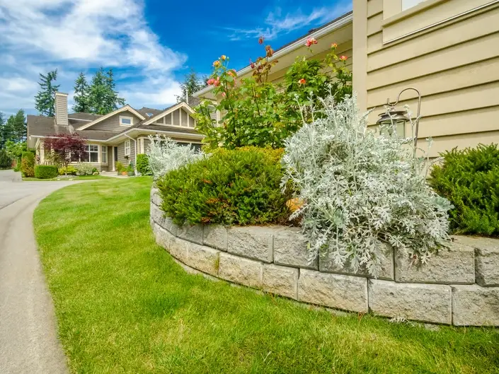 Landscape Architect planning retaining wall and patio drainage for a Shoreline Hills backyard